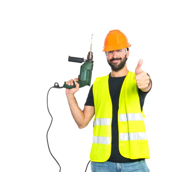 workman with drill over white background